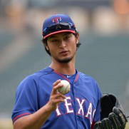 CHICAGO, IL - AUGUST 4:  Yu Darvish #11 of the Texas Rangers stands on the field during batting practice before the game against the Chicago White Sox at U.S. Cellular Field on August 4, 2014 in Chicago, Illinois. The White Sox defeated the Ranger 5-3 in a rain-shortened game.  (Photo by Brian D. Kersey/Getty Images)